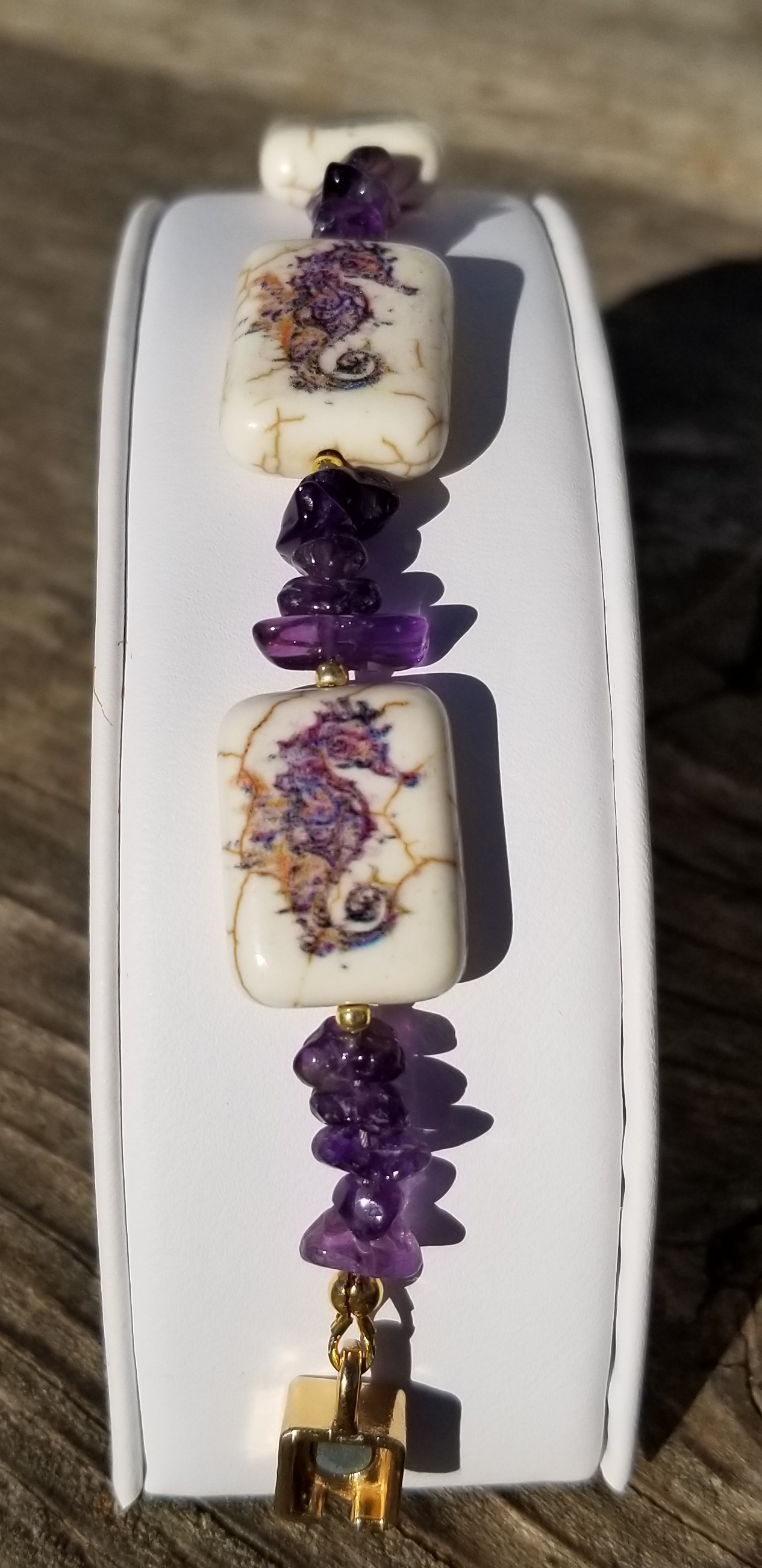 a couple of necklaces sitting on top of a white box