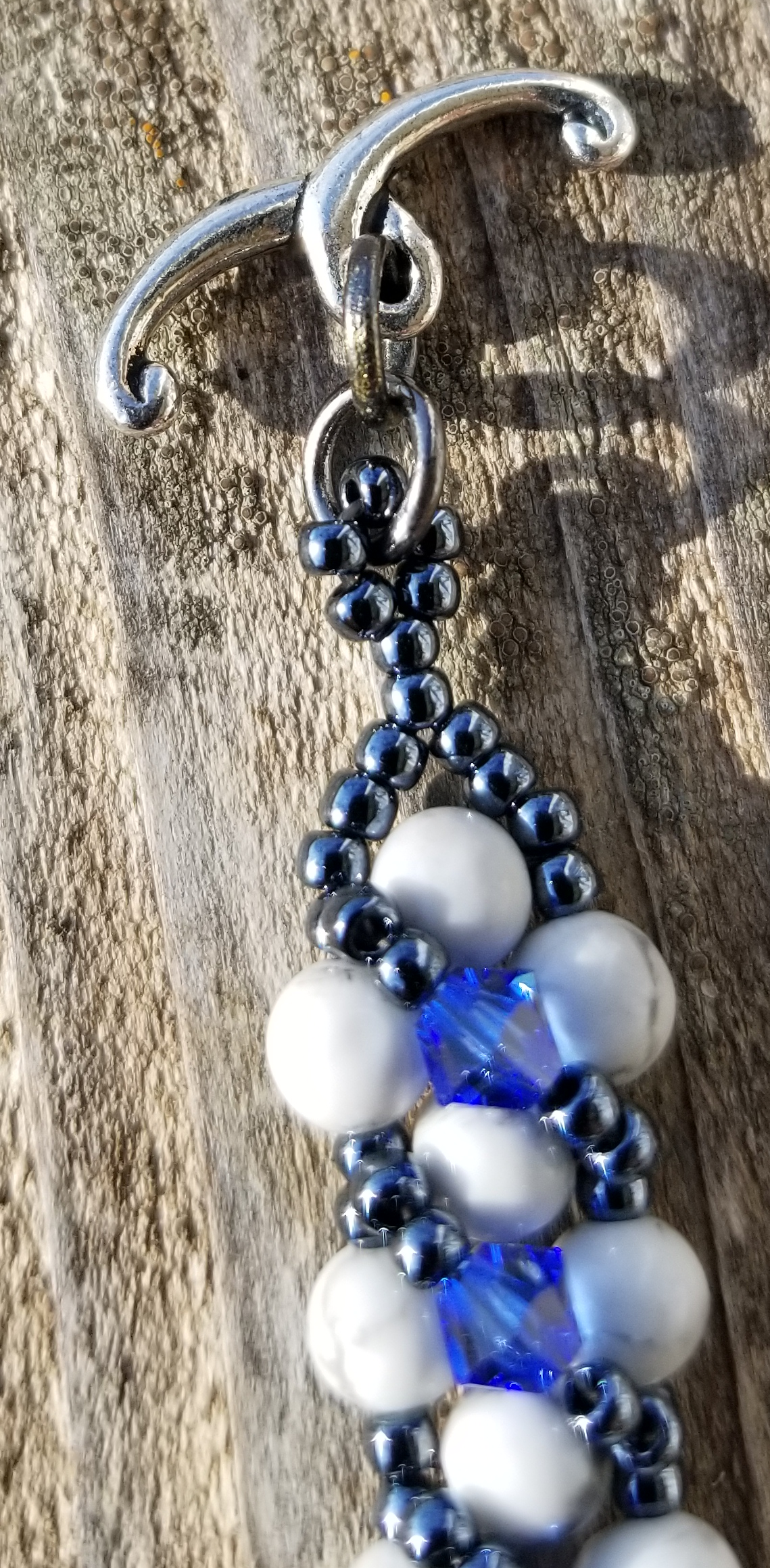 a blue and white beaded key chain