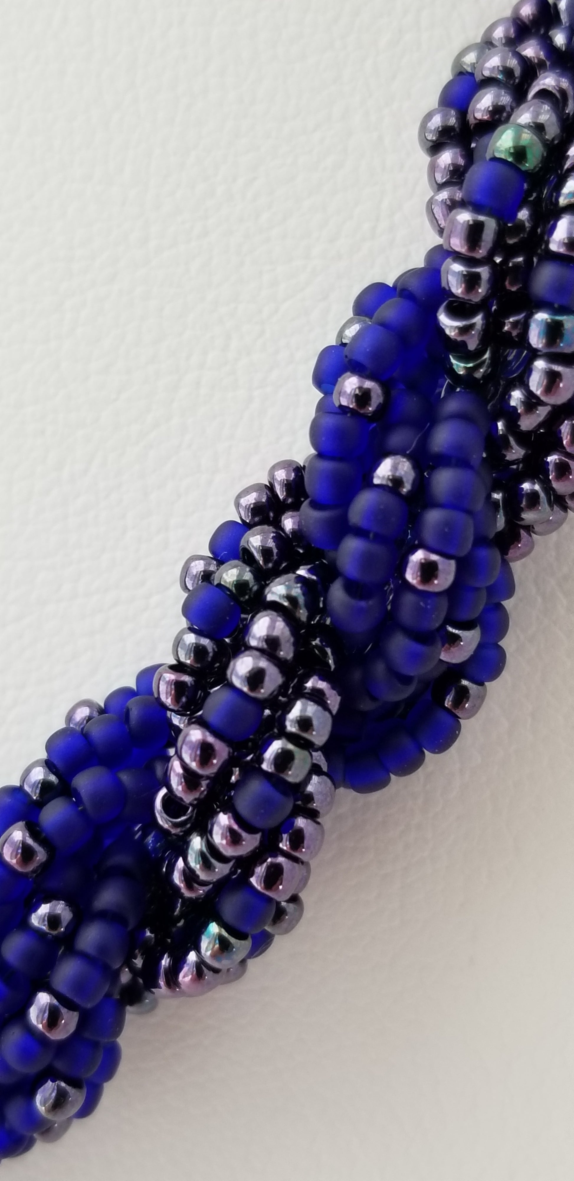 a close up of a bracelet made of beads