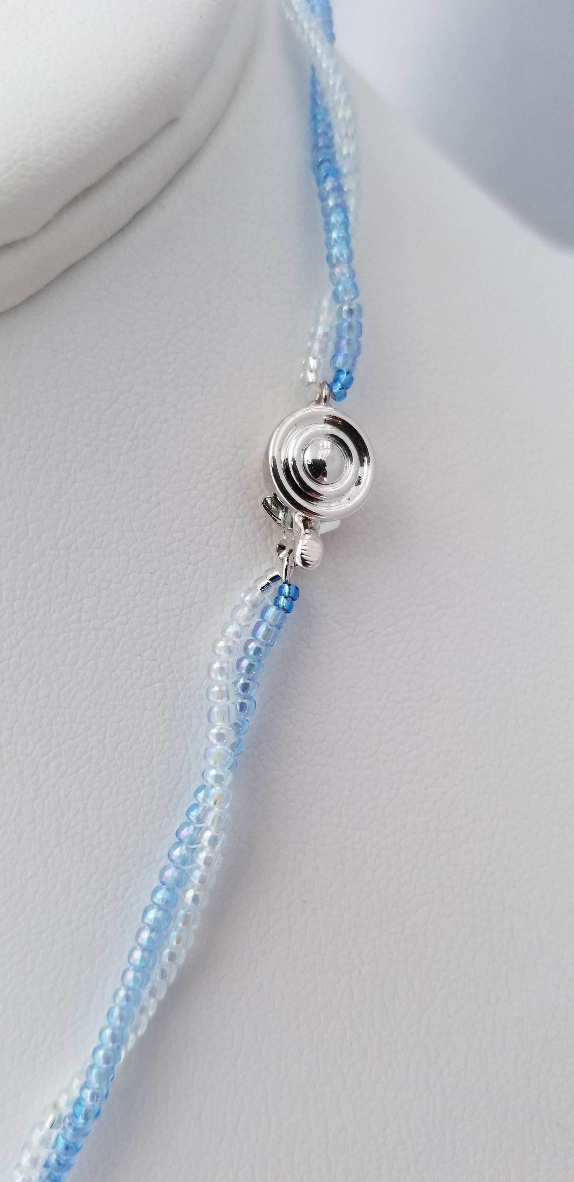 a beaded bracelet on a white surface